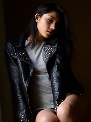 Antoinette exudes a lusty swagger wearing a black leather jacket and an intense gaze in her eyes.
